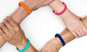 Joined Wrists Wearing Silicone Wristbands to prove Togetherness