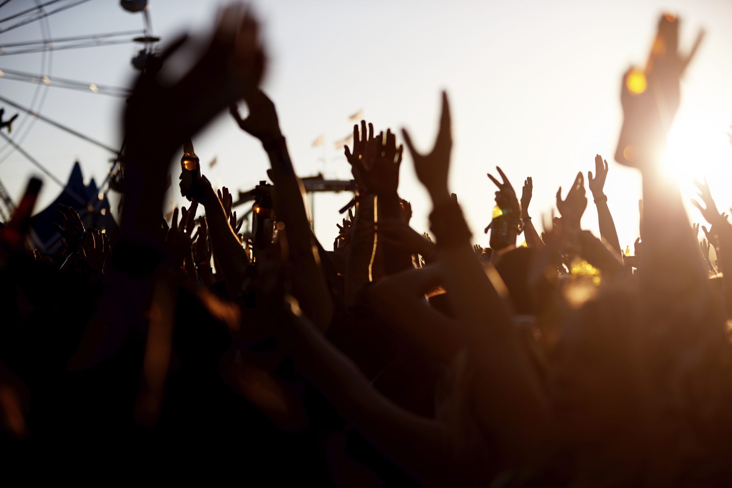 Lots of Arms in a Social Setting Wearing Silicone Wristbands