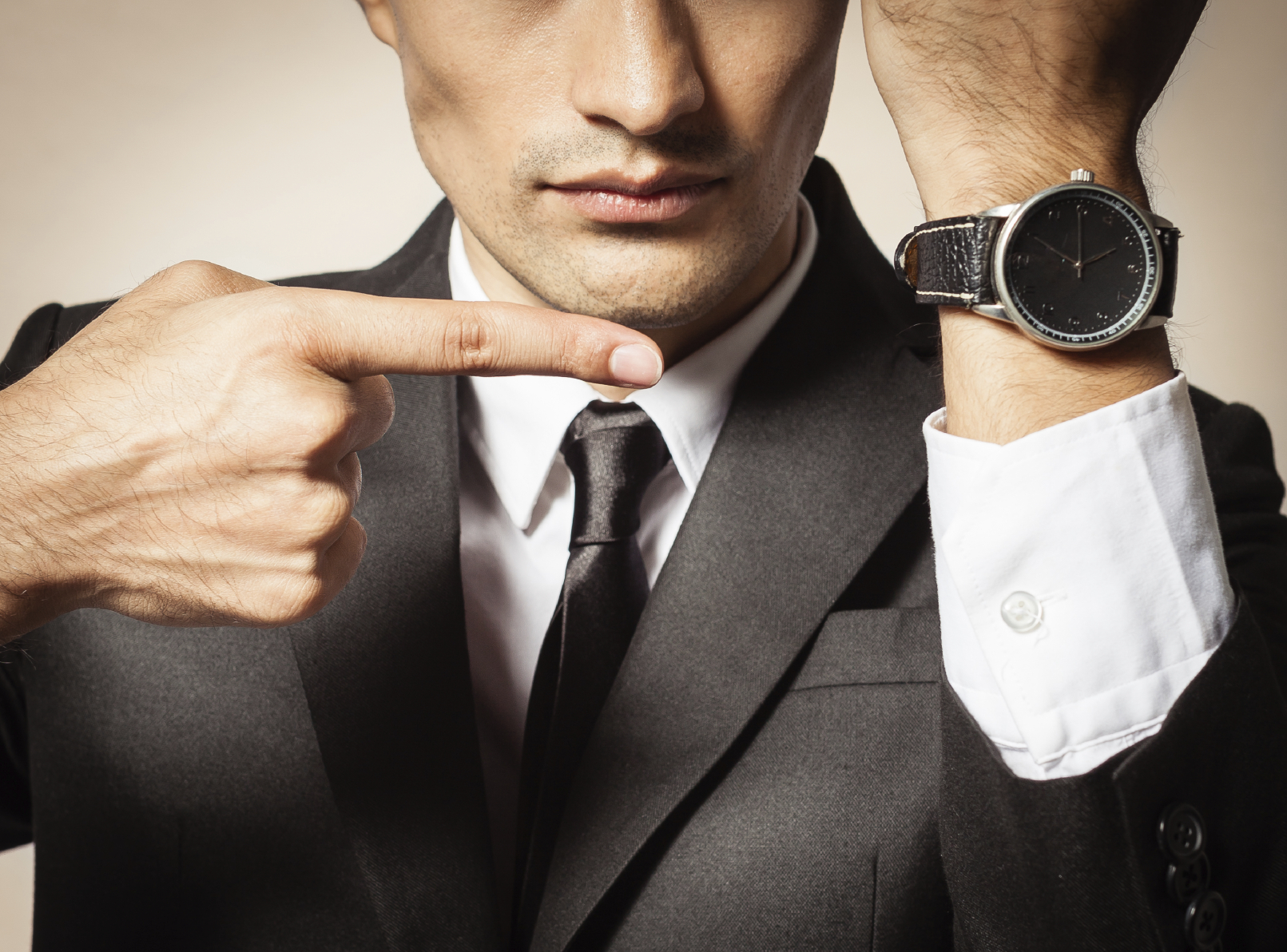 Businessman Showing Time on Watch - iStock_000051936248_Medium