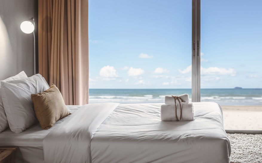 Hotel Bed in Room Overlooking Sea that Can be Accessed with Silicone Wristbands