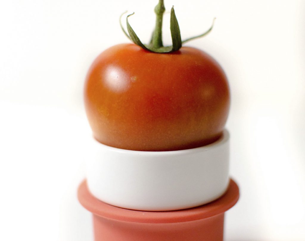 Silicone Food Hugger Holding a Tomato