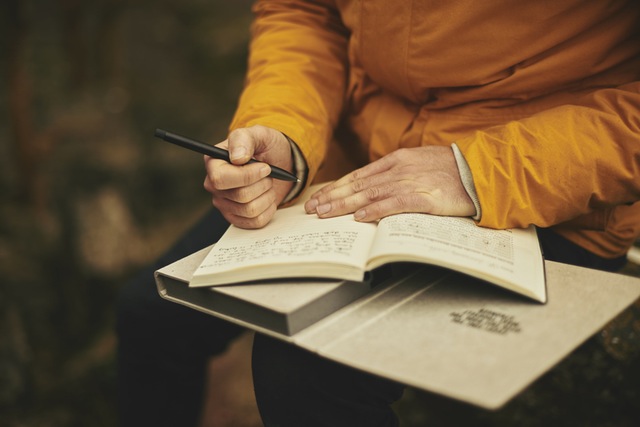 man taking notes