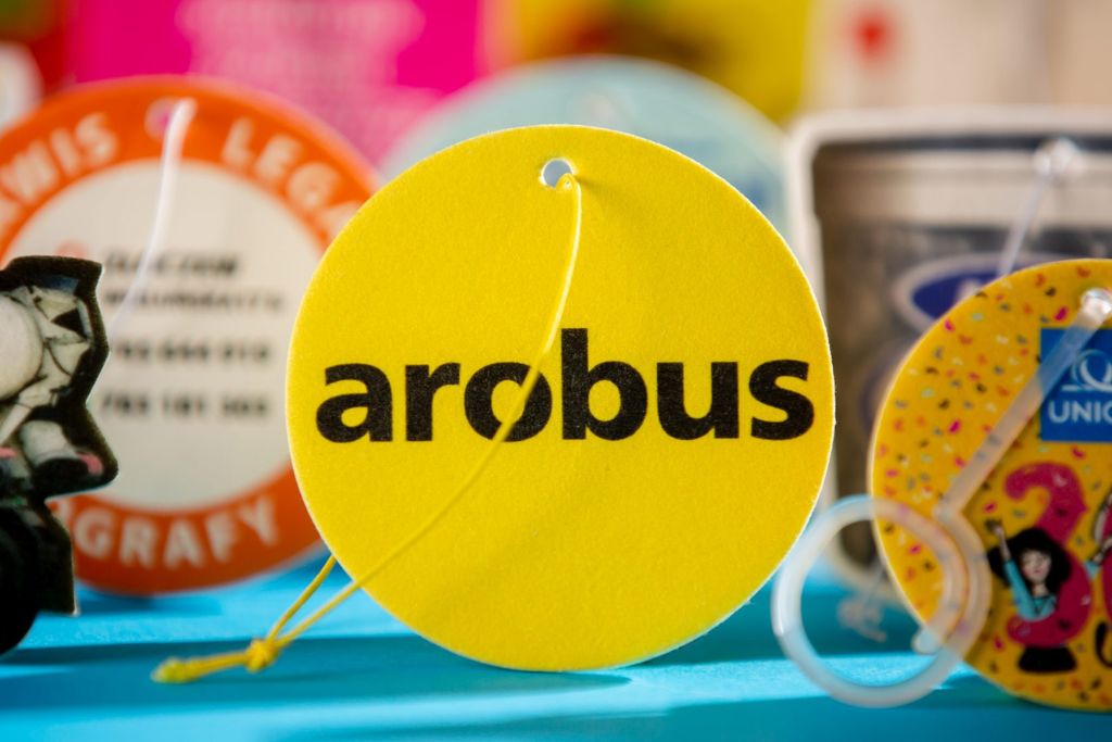 Example of bright yellow car air freshener used for branding the black letters on yellow background stand out