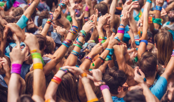 The different uses for silicone wristbands - shows a crowd wearing different coloured silicone wristbands